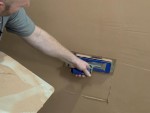 A Faithfull trowel with a polished steel blade and an ergonomic handle, for applying and finishing mortar, plaster, and adhesive.