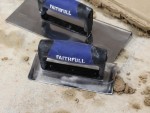 A Faithfull trowel with a polished steel blade and an ergonomic handle, for applying and finishing mortar, plaster, and adhesive.