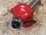A Faithfull plunge router with a fine depth adjuster and a guide fence, for cutting grooves, rebates, and profiles in timber.