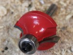 A Faithfull plunge router with a fine depth adjuster and a guide fence, for cutting grooves, rebates, and profiles in timber.
