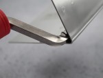 A Faithfull trowel with a polished steel blade and an ergonomic handle, for applying and finishing mortar, plaster, and adhesive.