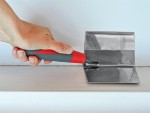 A Faithfull trowel with a polished steel blade and an ergonomic handle, for applying and finishing mortar, plaster, and adhesive.