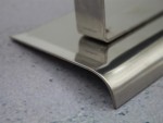 A Faithfull trowel with a polished steel blade and an ergonomic handle, for applying and finishing mortar, plaster, and adhesive.