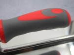 A Faithfull trowel with a polished steel blade and an ergonomic handle, for applying and finishing mortar, plaster, and adhesive.