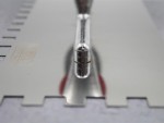 A Faithfull notched tile trowel with 10mm notches for combing adhesive on floors and walls, ensuring even coverage beneath tiles.
