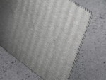 A Faithfull notched tile trowel with 3mm notches for combing adhesive on floors and walls, ensuring even coverage beneath tiles.
