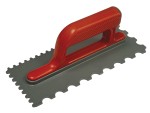 A notched trowel with a red handle and a rectangular metal blade, featuring evenly spaced square notches along the edges, used for spreading adhesives.