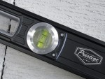 A Faithfull 120cm spirit level with an extruded aluminium body and accurate vials, for checking horizontal and vertical alignment.