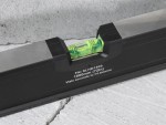 A Faithfull 180cm spirit level with an extruded aluminium body and accurate vials, for checking horizontal and vertical alignment.
