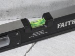 A Faithfull 60cm spirit level with an extruded aluminium body and accurate vials, for checking horizontal and vertical alignment.