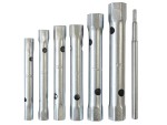 A set of six metal tubular box spanners of varying sizes and one matching metal rod, all arranged upright in a row on a white background.