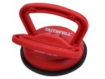 Red Faithfull brand suction cup lifter with dual handles, designed for lifting and handling smooth, non-porous materials like glass or tiles. The base is black, and the handles are positioned for a secure grip.
