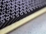 A brush with natural or synthetic bristles and an ergonomic handle, for applying coatings or cleaning surfaces.
