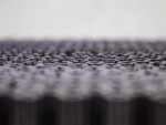 A brush with natural or synthetic bristles and an ergonomic handle, for applying coatings or cleaning surfaces.