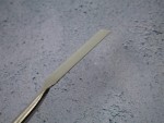 A Faithfull trowel with a polished steel blade and an ergonomic handle, for applying and finishing mortar, plaster, and adhesive.