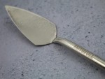 A Faithfull trowel with a polished steel blade and an ergonomic handle, for applying and finishing mortar, plaster, and adhesive.
