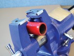 A Faithfull clamp with an adjustable jaw and a screw-tightening mechanism, for holding workpieces in position during cutting, drilling, or bonding.