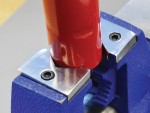 A Faithfull clamp with an adjustable jaw and a screw-tightening mechanism, for holding workpieces in position during cutting, drilling, or bonding.