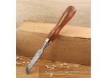 A hardened steel chisel with a bevelled cutting edge and a square-section body, for cutting stone, brick, or timber.