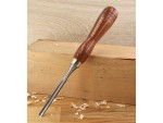 A hardened steel chisel with a bevelled cutting edge and a square-section body, for cutting stone, brick, or timber.