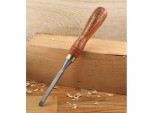A hardened steel chisel with a bevelled cutting edge and a square-section body, for cutting stone, brick, or timber.