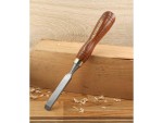 A hardened steel chisel with a bevelled cutting edge and a square-section body, for cutting stone, brick, or timber.
