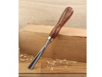 A hardened steel chisel with a bevelled cutting edge and a square-section body, for cutting stone, brick, or timber.