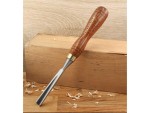 A hardened steel chisel with a bevelled cutting edge and a square-section body, for cutting stone, brick, or timber.