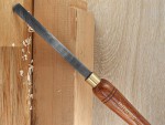 A hardened steel chisel with a bevelled cutting edge and a square-section body, for cutting stone, brick, or timber.